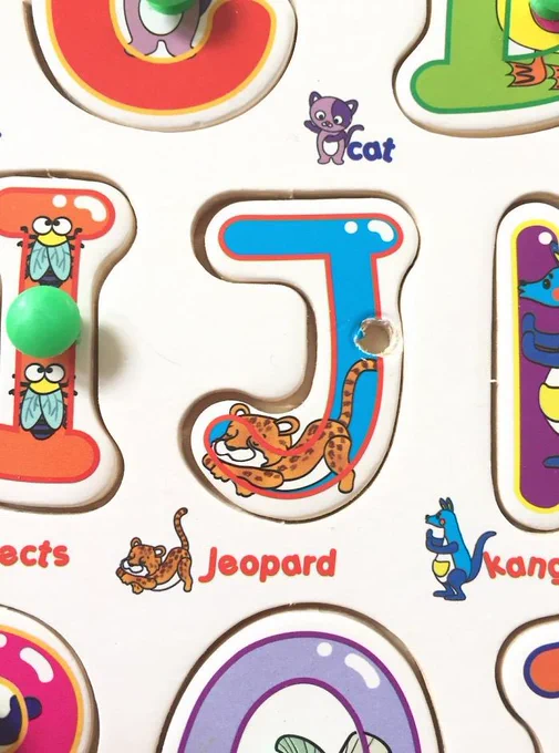 A kid's alphabet puzzle letter "J" but it says "Jeopard" with a picture of what looks like a jaguar-leopard hybrid
